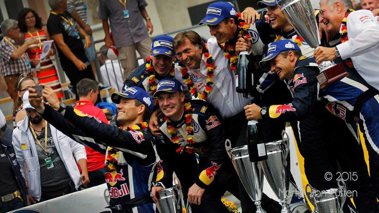 WRC podium with the Volkswagen team. Photograph retains the original credit.